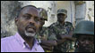 Mayor of Mogadishu, Mohamoud Nur (left), talks beside African Union Peacekeepers in Mogadishu, Somalia. Photo: AP /Kathrine Houreld 