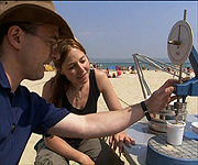 Alice and Matthew using a cone penotrometer to test the sand