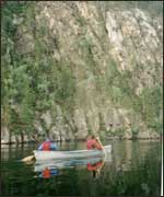 Pupils on canoe on lake in Norway 