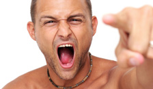 A man pointing and shouting