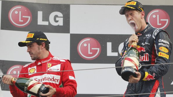 Alonso (left) and Sebastian Vettel