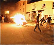 Tar Barrels, torches and crepe paper floats