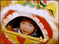 Chinese child in dragon costume