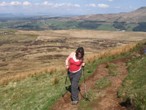 Julie McElroy using walking poles on 'The Whangie'