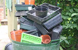 Plastic pots: the ethical debate (Image: pile of plastic trays and pots)