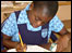 Child doing homework in Ghana