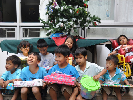 Children receiving donated Christmas presents
