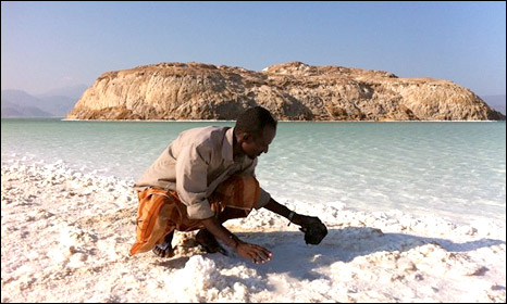 Ali Hamid mining salt by hand at Lake Assal
