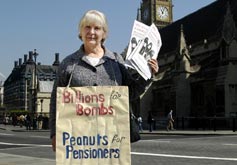 An image of a pensions protestor outside Parliament.