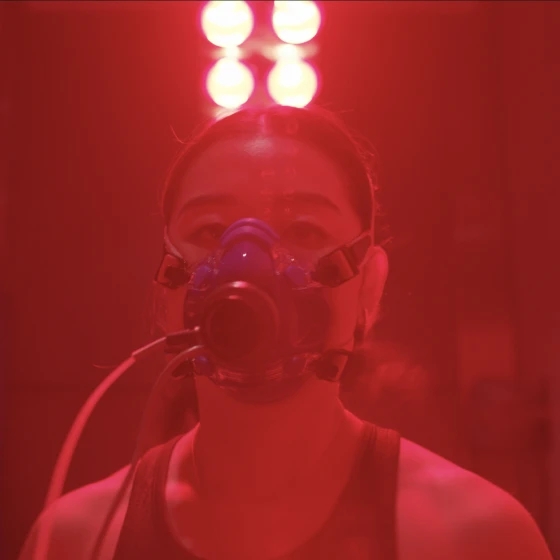 A woman wearing an oxygen mask.